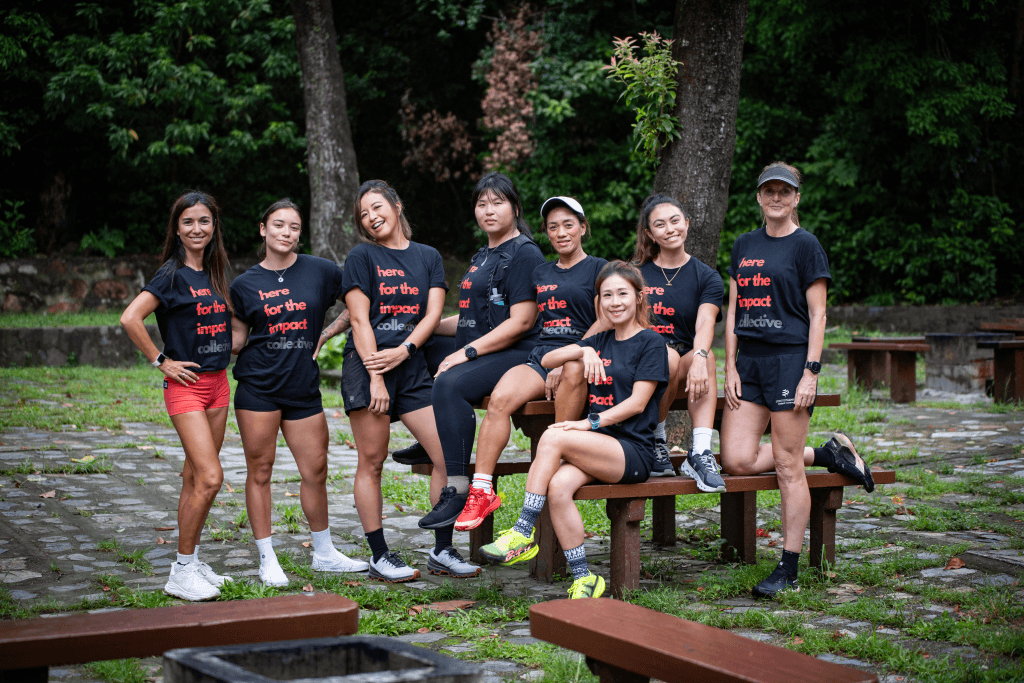 Picture of women race ambassadors in a park with the black and red t-shirts
